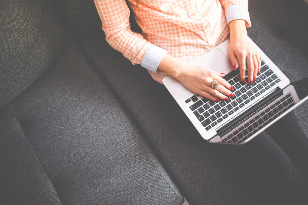 Image of lady typing on computer