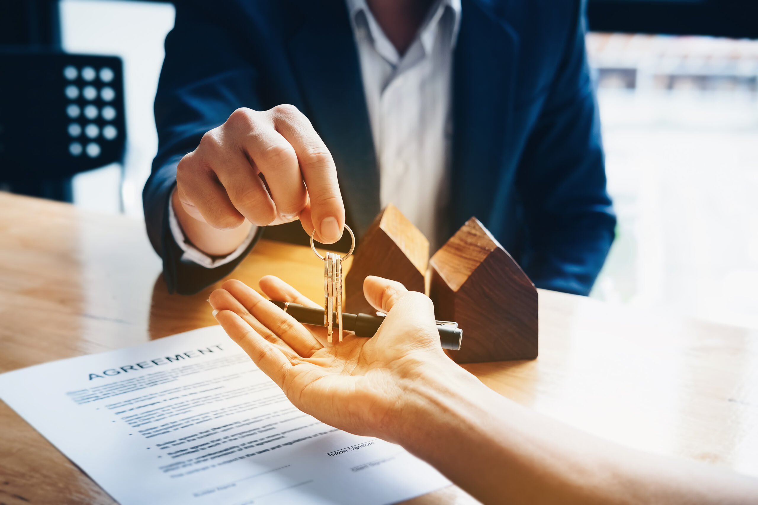 Real estate agents agree to buy a home and give keys to clients